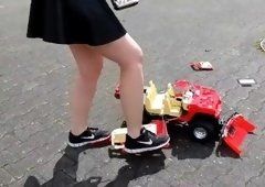 Girls crushing toy cars