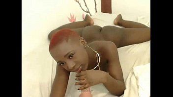An oiled ebony bald pussy.