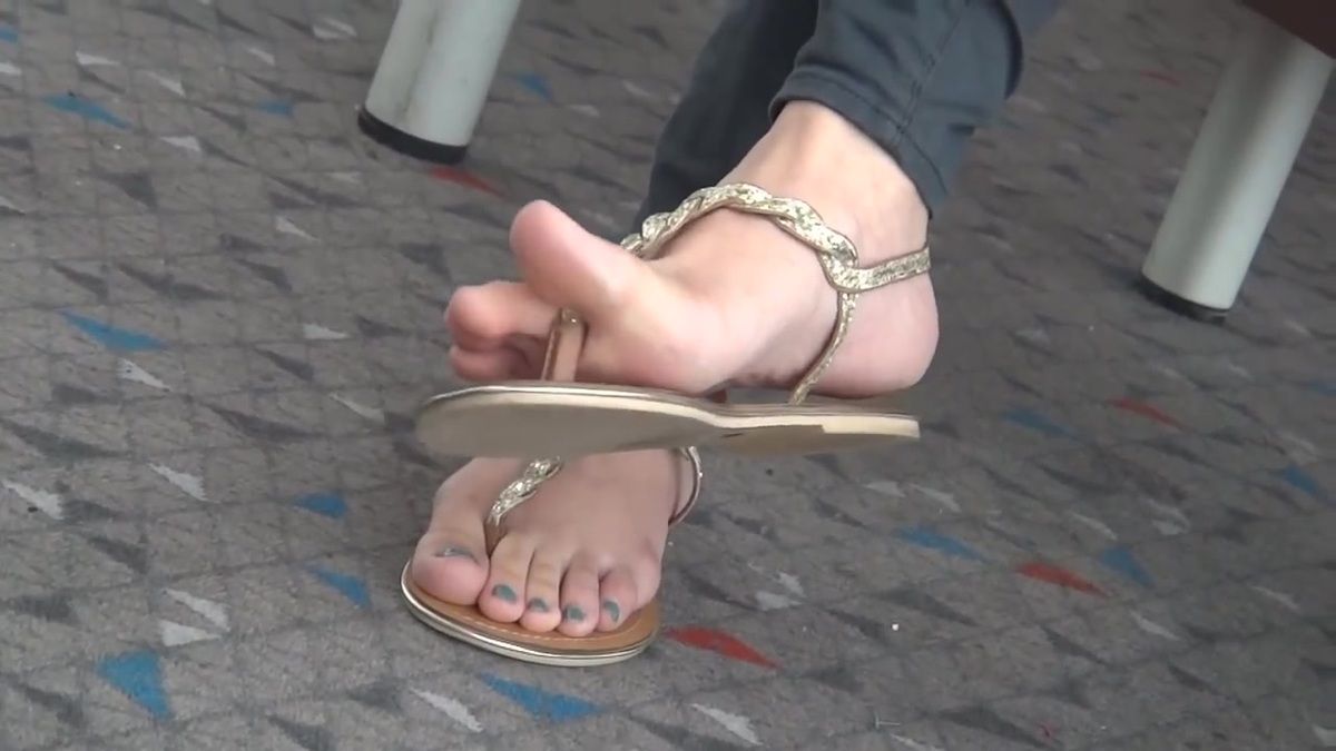 Sexy co-worker feet in sandals.
